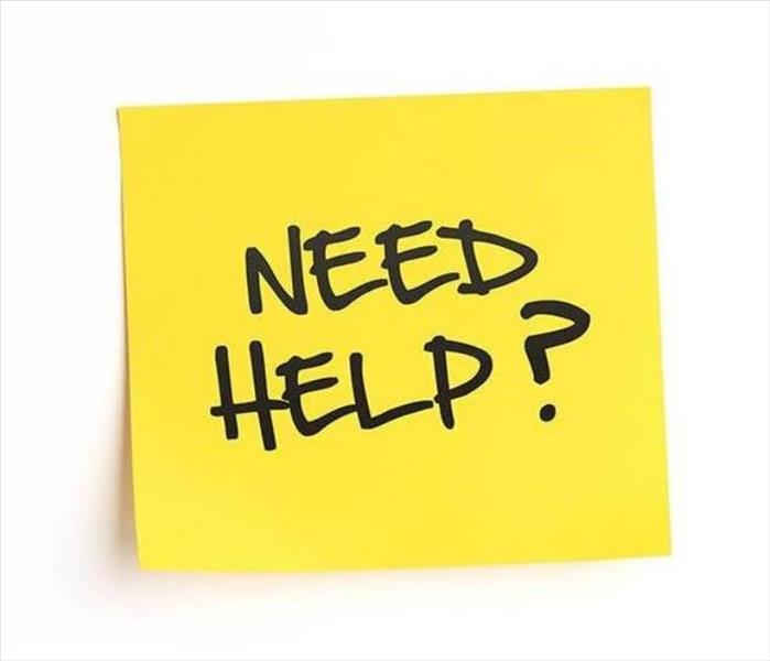 a yellow sticky note that says "need help?"